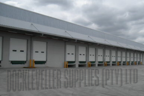 Insulated sectional industrial door with torsion spring balance, track options and integrated safety systems for commercial applications in South Africa.