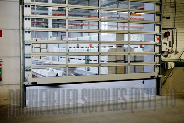 High speed Sprint sectional door with rapid opening panels for industrial and commercial environments.